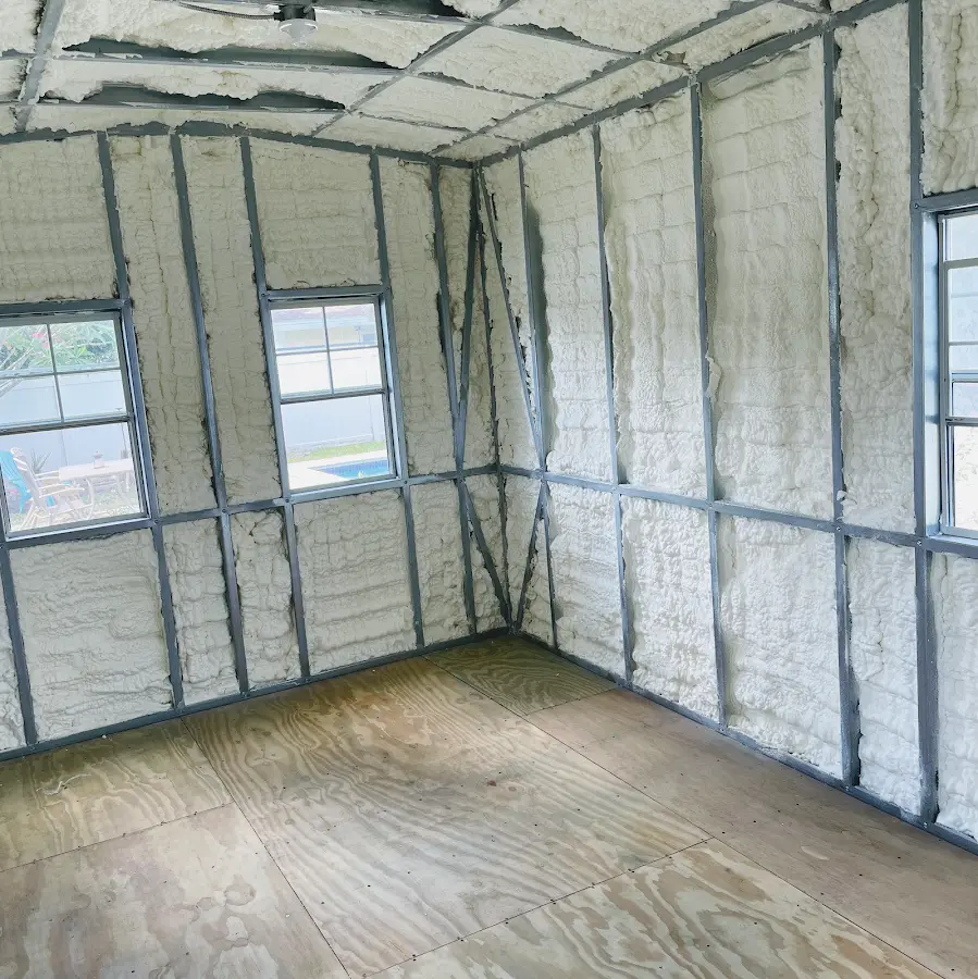 Closed-cell spray foam insulation applied to wall cavities in a residential project in Royalton